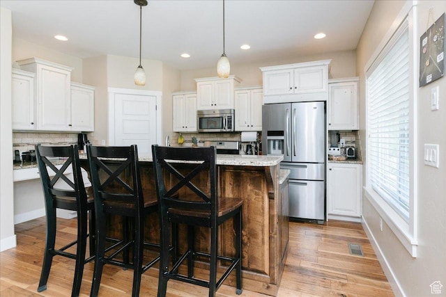 225 E 620 S, Smithfield, UT 84335 - kitchen with appliances with stainless steel finishes, decorative backsplash, white cabinetry, and recessed lighting