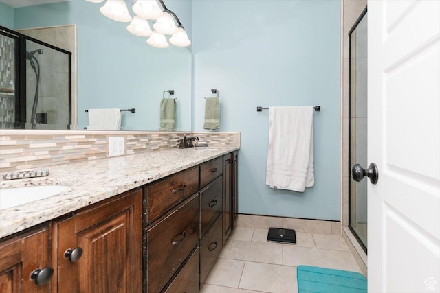 225 E 620 S, Smithfield, UT 84335 - bathroom featuring a stall shower, tile patterned flooring, double vanity, decorative backsplash, and a chandelier