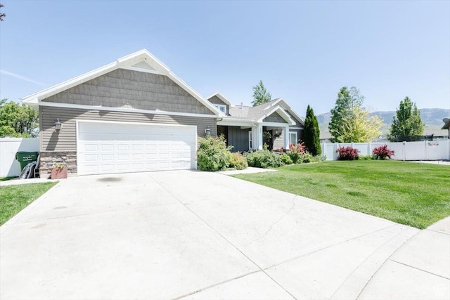 225 E 620 S, Smithfield, UT 84335 - craftsman-style house with an attached garage, driveway, and stone siding