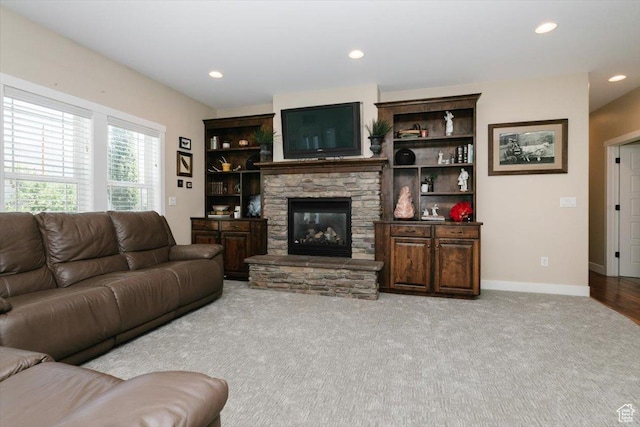 225 E 620 S, Smithfield, UT 84335 - carpeted living area featuring a stone fireplace, recessed lighting, and baseboards