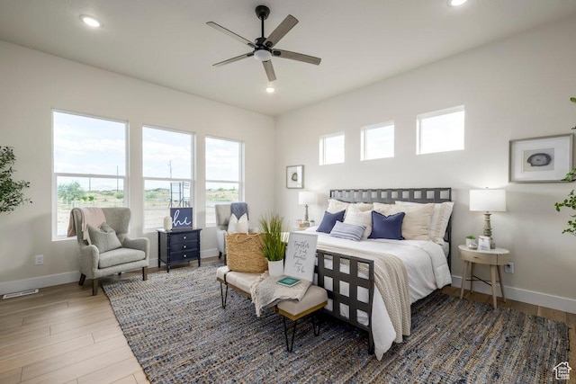 1104 N Windflower Ln Unit 127, Grantsville, UT 84029 - bedroom with baseboards, wood finished floors, recessed lighting, and a ceiling fan