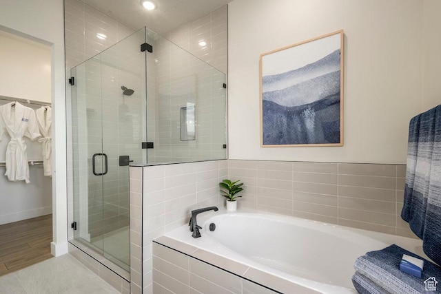 1104 N Windflower Ln Unit 127, Grantsville, UT 84029 - full bath with a garden tub, a stall shower, baseboards, and recessed lighting