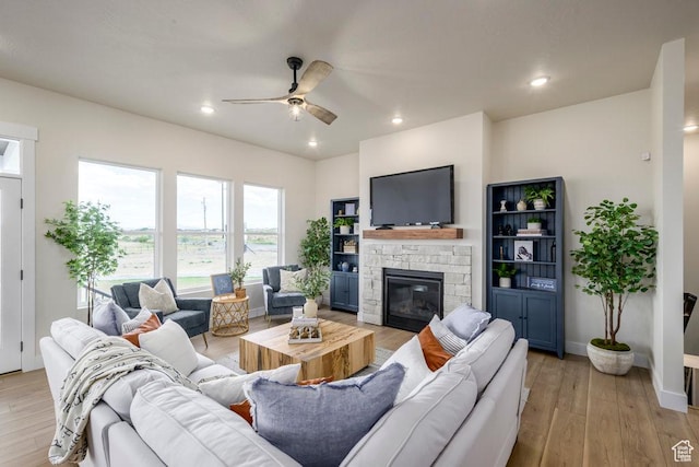 1104 N Windflower Ln Unit 127, Grantsville, UT 84029 - living room featuring ceiling fan, a fireplace, light wood-style flooring, recessed lighting, and baseboards
