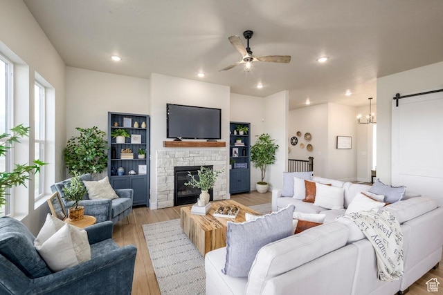 1104 N Windflower Ln Unit 127, Grantsville, UT 84029 - living area with light wood finished floors, ceiling fan, a fireplace, and recessed lighting