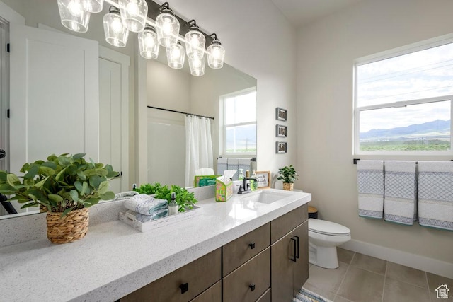 1104 N Windflower Ln Unit 127, Grantsville, UT 84029 - bathroom with vanity, toilet, tile patterned flooring, a shower with shower curtain, and a chandelier