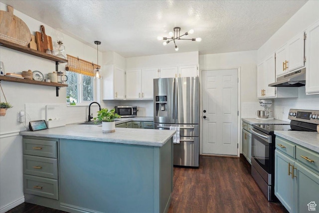 587 W 1460 N, Clinton, UT 84015 - kitchen with stainless steel appliances, under cabinet range hood, a sink, dark wood-style flooring, and decorative backsplash