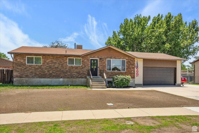 587 W 1460 N, Clinton, UT 84015 - ranch-style house with driveway, an attached garage, and brick siding