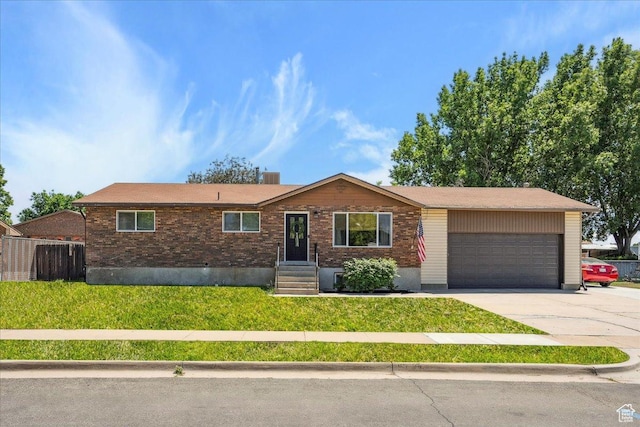 587 W 1460 N, Clinton, UT 84015 - ranch-style home with a garage, concrete driveway, and brick siding