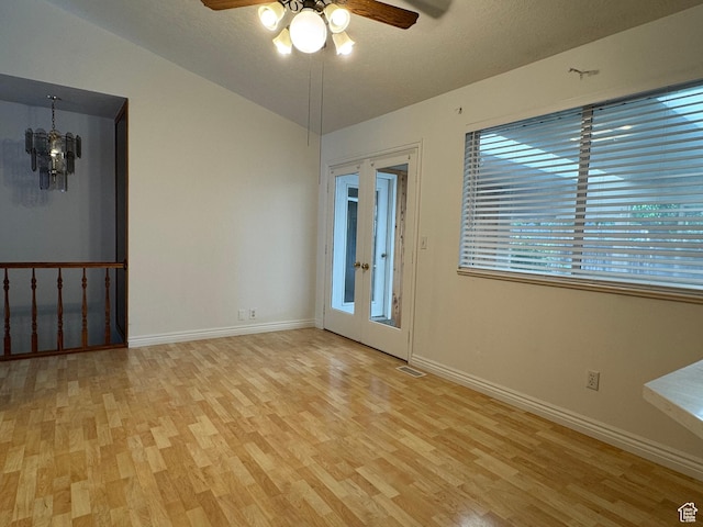4440 W 6095 S, Taylorsville, UT 84118 - unfurnished room featuring light wood-style flooring, a ceiling fan, baseboards, a chandelier, and vaulted ceiling