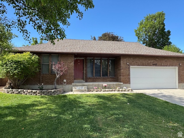 4440 W 6095 S, Taylorsville, UT 84118 - ranch-style house featuring a garage, brick siding, a front lawn, and concrete driveway
