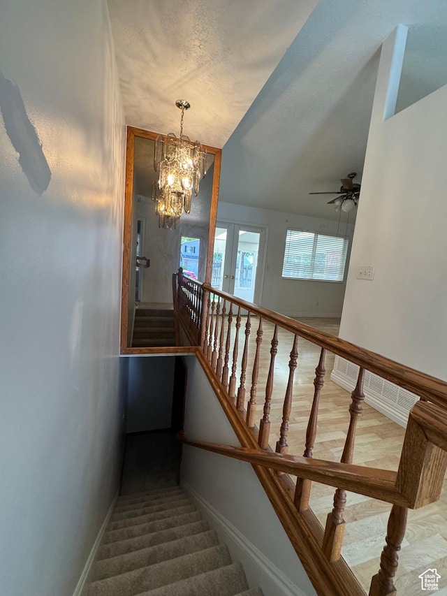 4440 W 6095 S, Taylorsville, UT 84118 - staircase featuring a chandelier, baseboards, and a ceiling fan