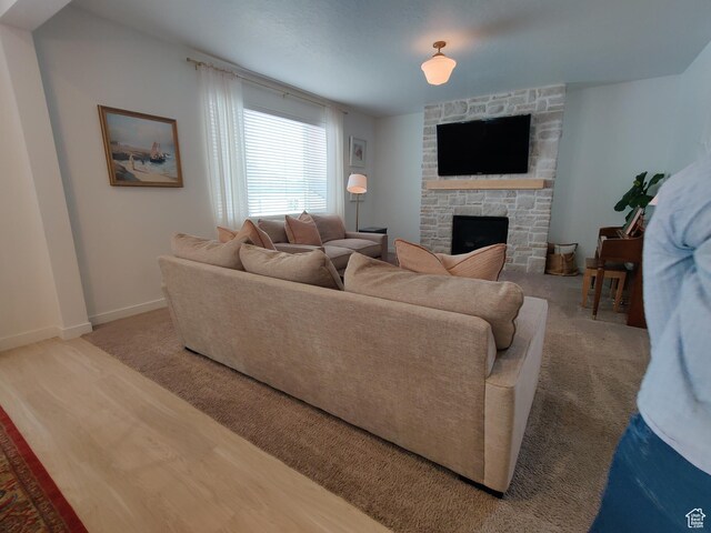 2132 N Elderberry Dr W, Saratoga Springs, UT 84045 - living room featuring a fireplace, baseboards, and carpet