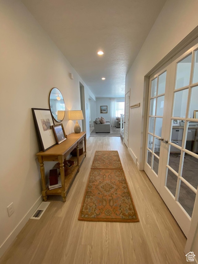 2132 N Elderberry Dr W, Saratoga Springs, UT 84045 - corridor featuring french doors, light wood-style flooring, baseboards, and recessed lighting