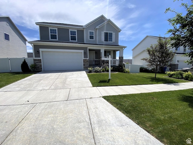 2132 N Elderberry Dr W, Saratoga Springs, UT 84045 - craftsman inspired home featuring covered porch, concrete driveway, a garage, and stone siding