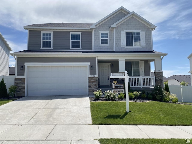 2132 N Elderberry Dr W, Saratoga Springs, UT 84045 - craftsman-style house featuring stone siding, a porch, and an attached garage