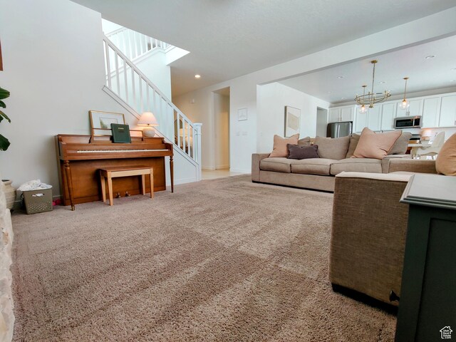2132 N Elderberry Dr W, Saratoga Springs, UT 84045 - living room featuring stairway, a chandelier, carpet floors, recessed lighting, and baseboards