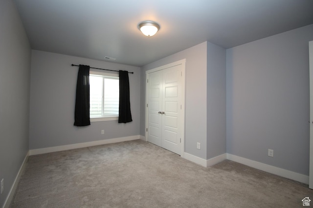 1457 W 400 S, Syracuse, UT 84075 - unfurnished bedroom featuring carpet flooring, baseboards, and a closet