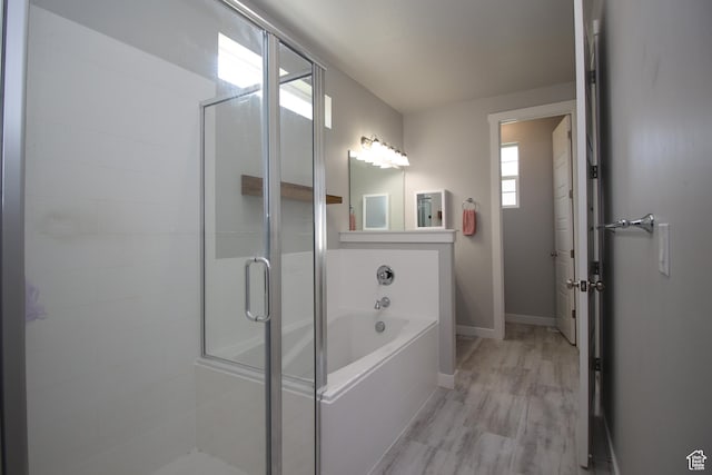 1457 W 400 S, Syracuse, UT 84075 - full bathroom with a stall shower, a bath, wood finished floors, and baseboards