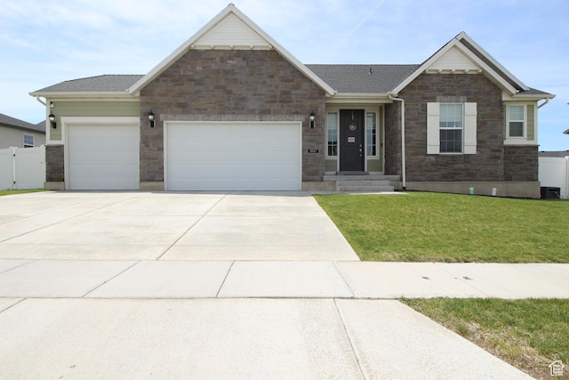 1457 W 400 S, Syracuse, UT 84075 - craftsman house featuring stone siding, a garage, and driveway