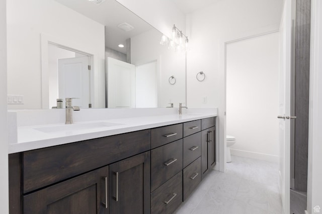 1517 W 470 N Unit 53, Hurricane, UT 84737 - full bathroom with double vanity, toilet, marble look tiles, and baseboards