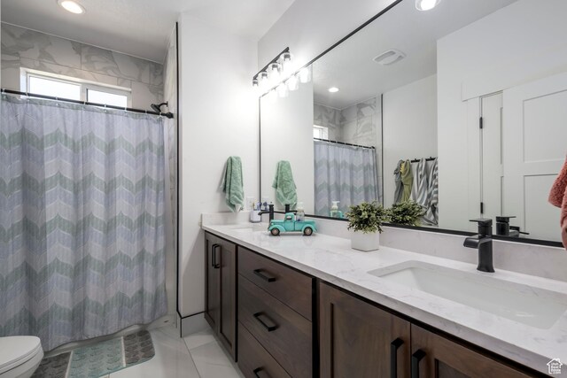 19722 Elkhorn Cir, Birdseye, UT 84629 - full bathroom featuring double vanity, toilet, a shower with shower curtain, and recessed lighting