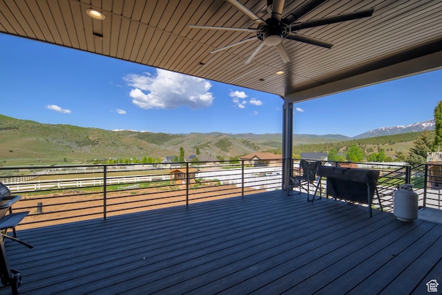 19722 Elkhorn Cir, Birdseye, UT 84629 - wooden deck featuring a mountain view, a ceiling fan, and a view of rural / pastoral area