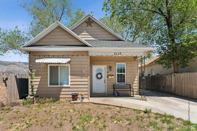 2120 Pingree Ave, Ogden, UT 84401 - view of front facade featuring a shingled roof and covered porch