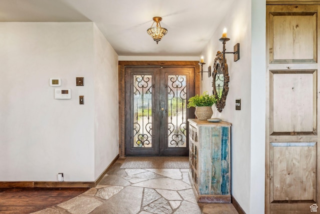4774 S Oak Terrace Dr, Millcreek, UT 84124 - foyer entrance featuring baseboards, french doors, and stone finish flooring