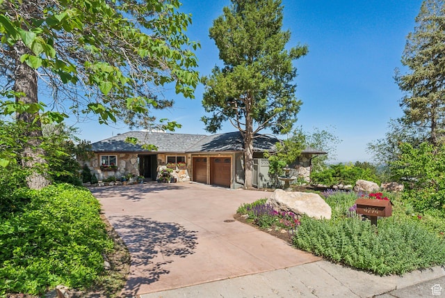 4774 S Oak Terrace Dr, Millcreek, UT 84124 - single story home with stone siding, an attached garage, and concrete driveway