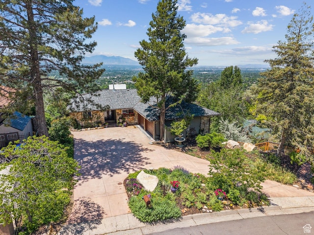 4774 S Oak Terrace Dr, Millcreek, UT 84124 - view of front of property featuring concrete driveway, a garage, and a mountain view