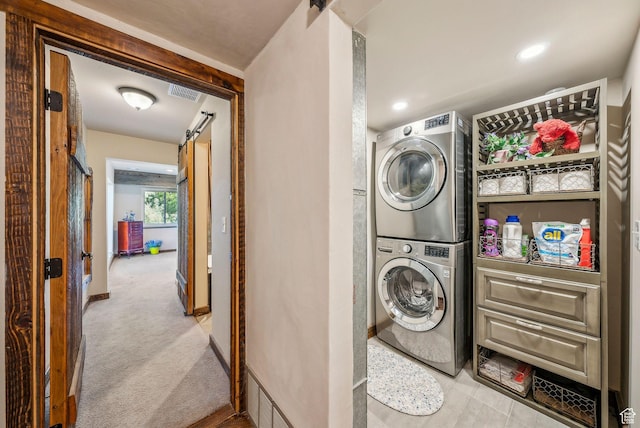 4774 S Oak Terrace Dr, Millcreek, UT 84124 - laundry area featuring stacked washer / drying machine, carpet floors, and baseboards