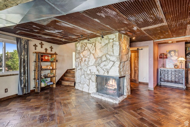 4774 S Oak Terrace Dr, Millcreek, UT 84124 - unfurnished living room with baseboards, a barn door, and a fireplace