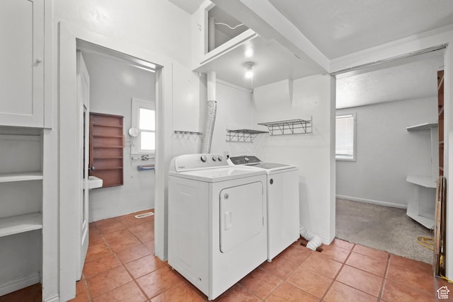 665 S Emery St W, Salt Lake City, UT 84104 - laundry room featuring washing machine and dryer, light tile patterned flooring, and light carpet
