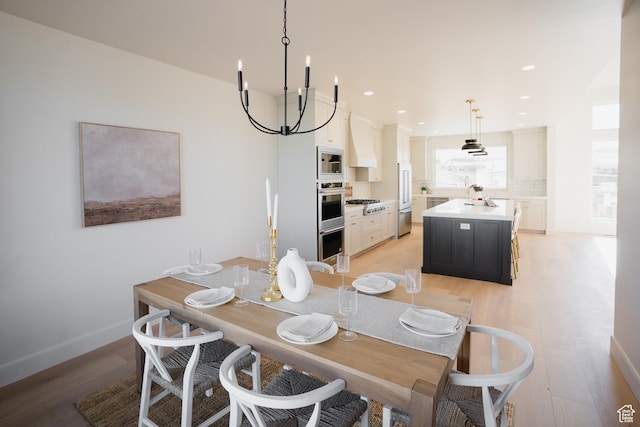 487 W 1200 N, Mapleton, UT 84664 - dining space featuring light wood-type flooring, a chandelier, baseboards, and recessed lighting