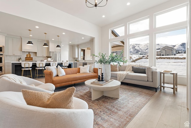 487 W 1200 N, Mapleton, UT 84664 - living room with recessed lighting, light wood-type flooring, a chandelier, and a mountain view