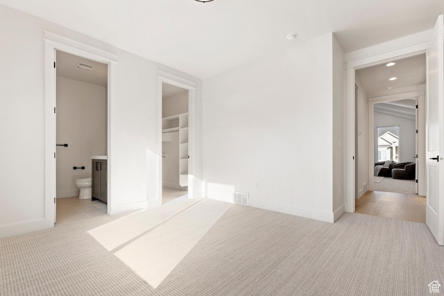 487 W 1200 N, Mapleton, UT 84664 - unfurnished bedroom featuring light colored carpet, baseboards, a spacious closet, ensuite bathroom, and recessed lighting