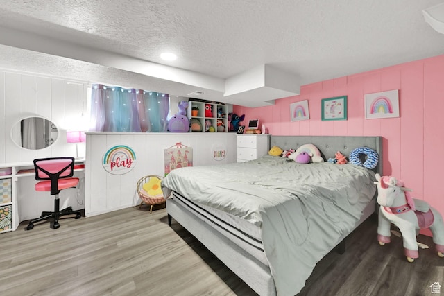2883 S Brinker Ave E, Ogden, UT 84403 - bedroom featuring a textured ceiling, wood finished floors, and recessed lighting