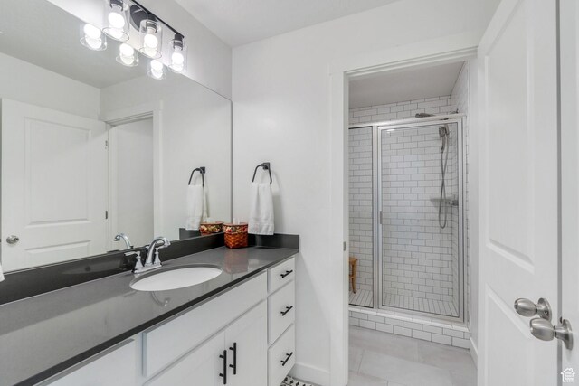 6439 W S Jordan Pkwy, South Jordan, UT 84009 - full bathroom with vanity, a stall shower, and tile patterned floors