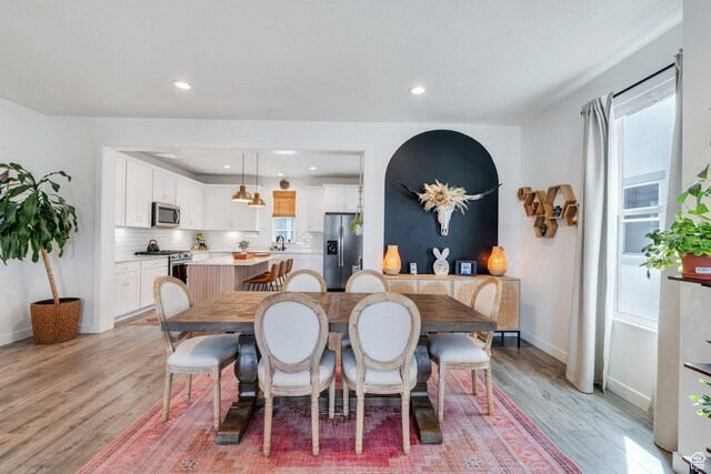 6439 W S Jordan Pkwy, South Jordan, UT 84009 - dining space featuring light wood-style floors, recessed lighting, and baseboards