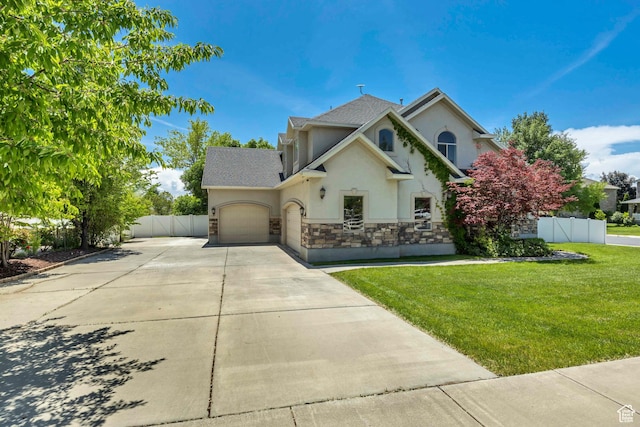 1162 E 1180 N, American Fork, UT 84003 - traditional-style house with stucco siding, concrete driveway, an attached garage, stone siding, and a shingled roof