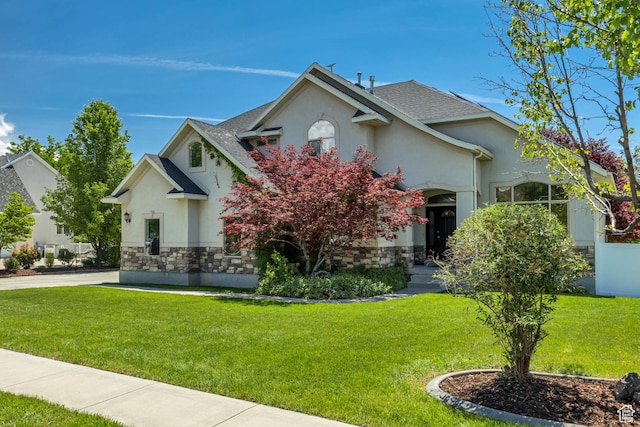 1162 E 1180 N, American Fork, UT 84003 - view of front of property with stucco siding, a front lawn, stone siding, and a shingled roof