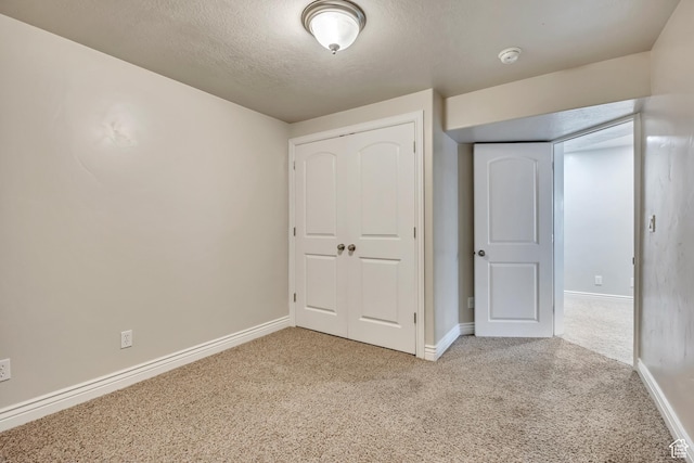 1162 E 1180 N, American Fork, UT 84003 - unfurnished bedroom featuring carpet floors, baseboards, a closet, and a textured ceiling