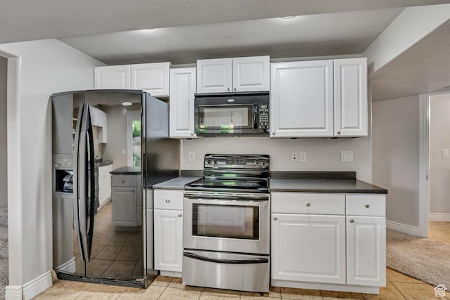 1162 E 1180 N, American Fork, UT 84003 - kitchen featuring black appliances, white cabinets, dark countertops, light tile patterned floors, and baseboards