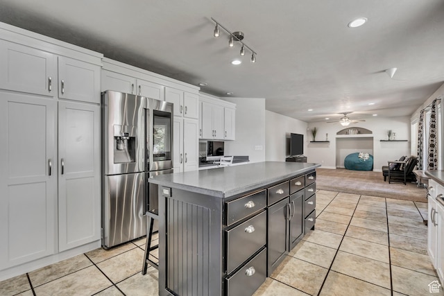 1162 E 1180 N, American Fork, UT 84003 - kitchen with stainless steel fridge, light tile patterned floors, white cabinets, a ceiling fan, and recessed lighting