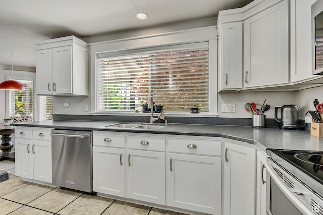 1162 E 1180 N, American Fork, UT 84003 - kitchen featuring appliances with stainless steel finishes, dark countertops, plenty of natural light, white cabinetry, and recessed lighting