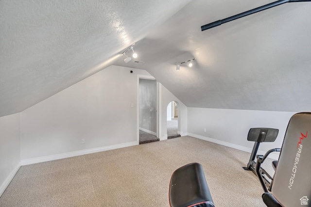 1162 E 1180 N, American Fork, UT 84003 - exercise room featuring rail lighting, vaulted ceiling, baseboards, and carpet floors