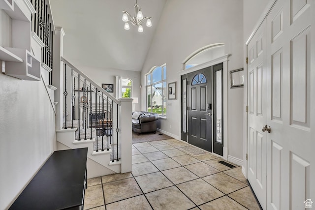 1162 E 1180 N, American Fork, UT 84003 - foyer with high vaulted ceiling, stairway, a chandelier, tile patterned flooring, and baseboards