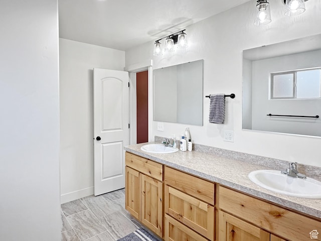 1005 S Valley View Ct, Moab, UT 84532 - bathroom with double vanity and baseboards