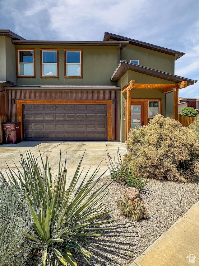 1005 S Valley View Ct, Moab, UT 84532 - view of front of property featuring stucco siding, driveway, and an attached garage