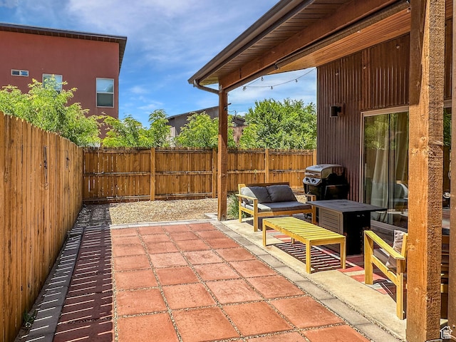 1005 S Valley View Ct, Moab, UT 84532 - fenced backyard with a patio, a grill, and an outdoor hangout area